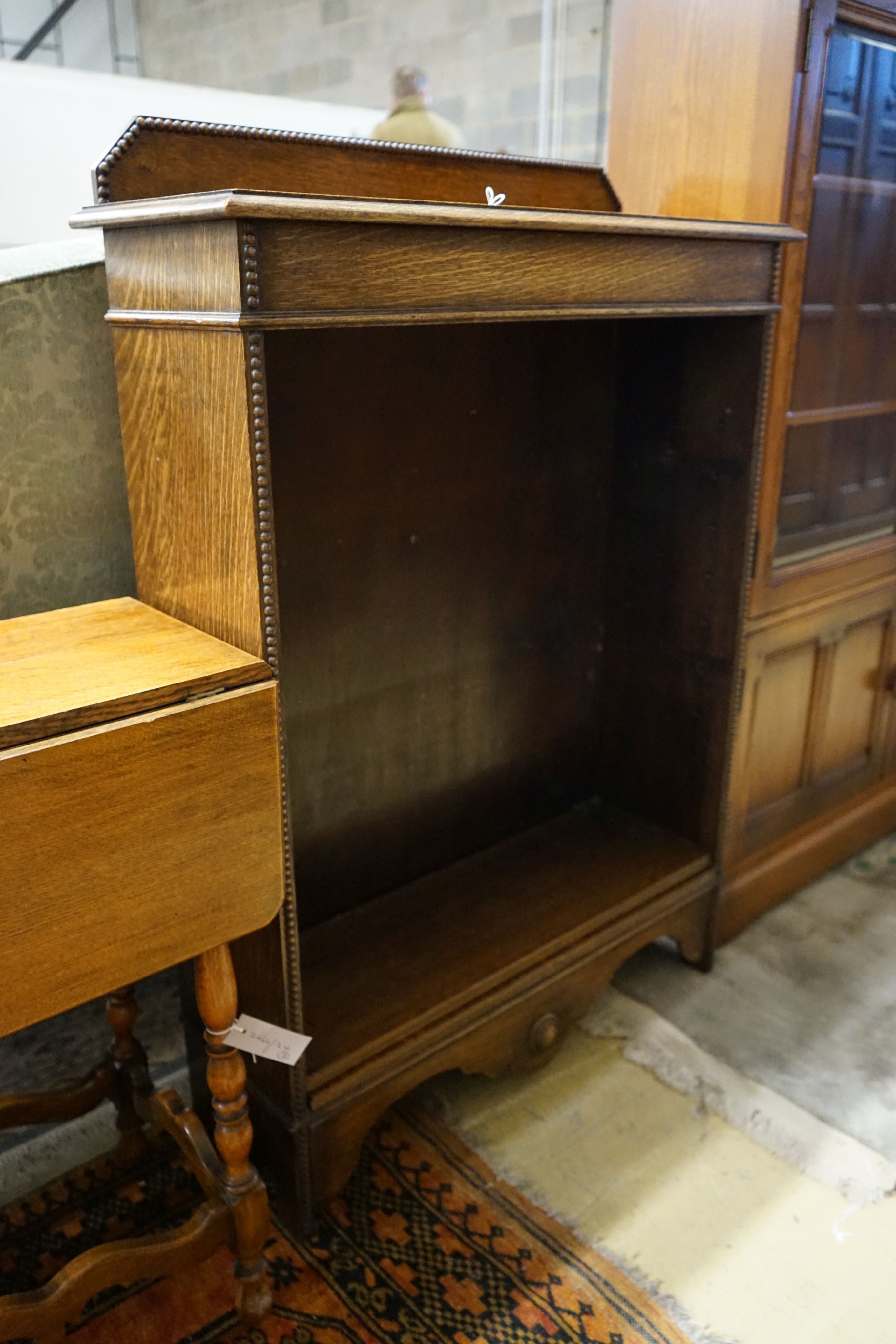 A small oak open bookcase, width 76cm, depth 27cm, height 109cm, together with a small oak gateleg occasional table